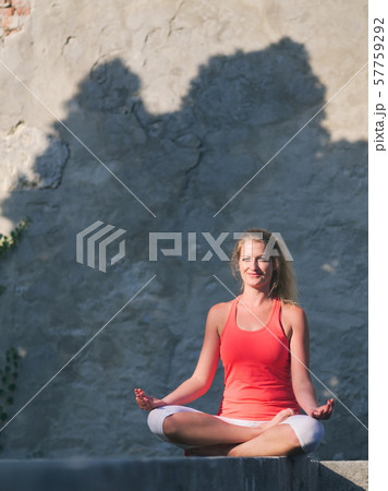 Woman Doing Yoga in the Park 57759292