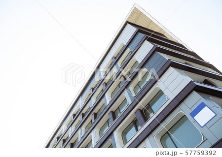 high modern black and white tiled urban building with house number board sign with copyspace. ground 57759392