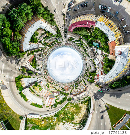 Aerial city view with crossroads and roads, houses, buildings, parks and parking lots. Sunny summer Aerial city view with crossroads and roads, houses, buildings, parks and parking lots. Sunny summer 57761128