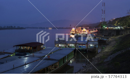 illuminate two travel Chinese boats park at pier,port of Chiang saen ,Chiang rai,Thailand . illuminate two travel Chinese boats park at pier,port of Chiang saen ,Chiang rai,Thailand . 57764313