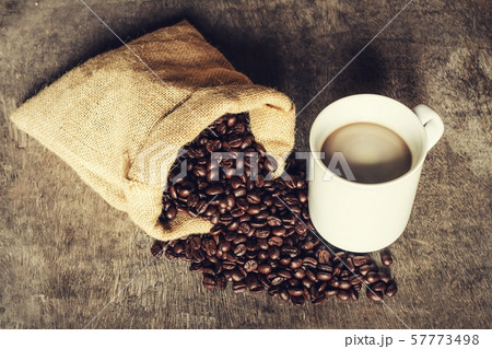 Coffee cup on a green background vintage. 57773498