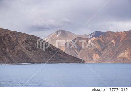Pangong Lake with rocky mountains situated on the 57774015