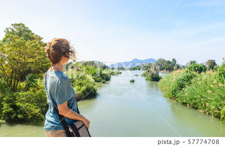 Woman looking at the Mekong River on the 4000 57774708