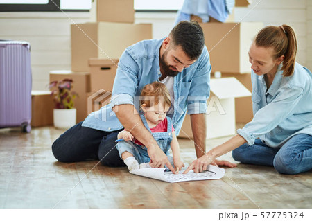 Caucasian family move in new big house 57775324