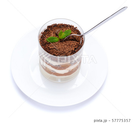 Classic tiramisu dessert in a glass cup on the plate on white background with clipping path 57775357