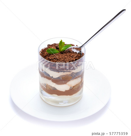 Classic tiramisu dessert in a glass cup on the plate on white background with clipping path Classic tiramisu dessert in a glass cup on the plate on white background with clipping path 57775359