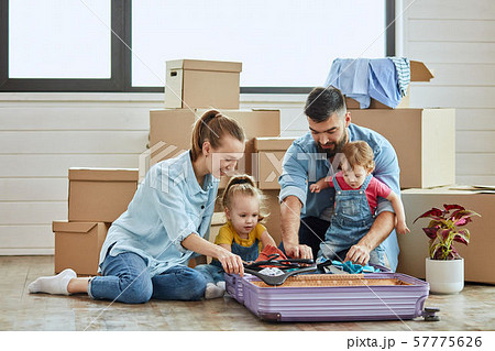 Caucasian family move in new house Caucasian family move in new house 57775626