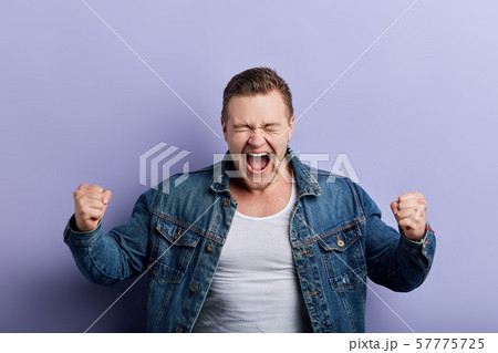 crazy funny man rejoicing at his victory, winning crazy funny man rejoicing at his victory, winning 57775725
