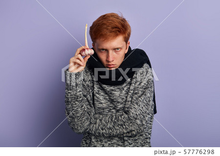 man suffers from cold, flu. 57776298