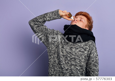 young man has problems with health , he suffers from allergy young man has problems with health , he suffers from allergy 57776303