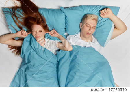 anry nervous woman closing her ears with fingers 57776550