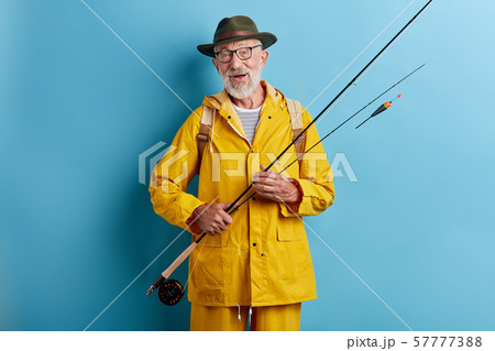 emotional excited old man gets pleasure from his favourite hobby 57777388