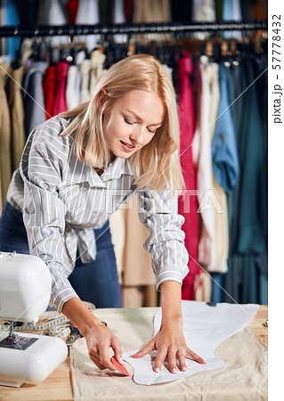 talented dressmaker making up a project, model 57778432