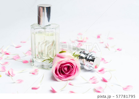 Perfume bottles and rose on white background 57781795