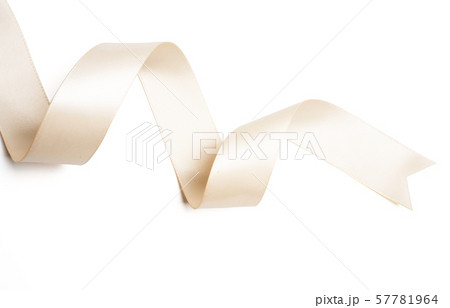 cream ribbon in roll on white Stock Photo