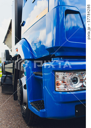 closeup photo of spotlight and wheels of tractor. 57784286