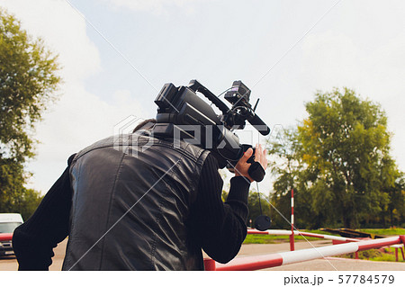 The videographer is working on the report. The videographer is working on the report. 57784579