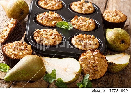 Healthy breakfast pear muffins with walnuts and Healthy breakfast pear muffins with walnuts and 57784899