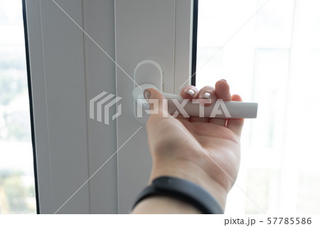 Female hand open plastic pvc white window to get Female hand open plastic pvc white window to get 57785586