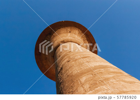 Columns in Karnak Temple Complex, famous architectural landmark in Luxor, Egypt. Pillars of the Great Hypostyle Hall from the Precinct of Amun-Re. 57785920