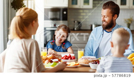 family mother father and children have Breakfast family mother father and children have Breakfast 57786819