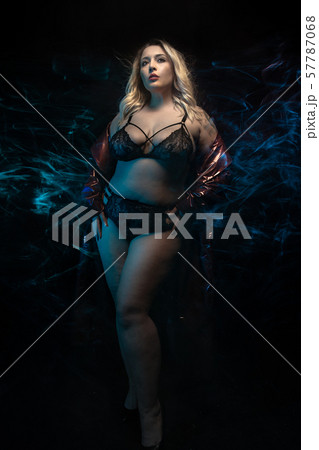 Plus size model in black lingerie. Fog effect. 57787068