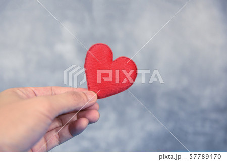 heart on hand for philanthropy concept - man 57789470