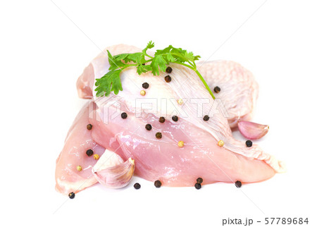 raw chicken breast with herbs and spices isolated raw chicken breast with herbs and spices isolated 57789684