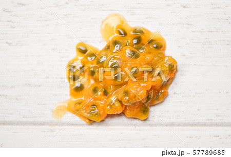 Passion fruit seeds close up on wooden  background 57789685