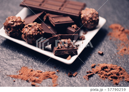 chocolate bar and chocolate ball on white plate on chocolate bar and chocolate ball on white plate on 57790259