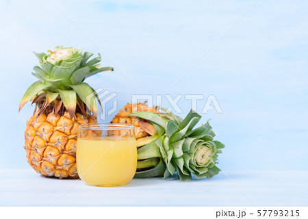 Pineapple juice in glass and ripe pineapple fruit 57793215