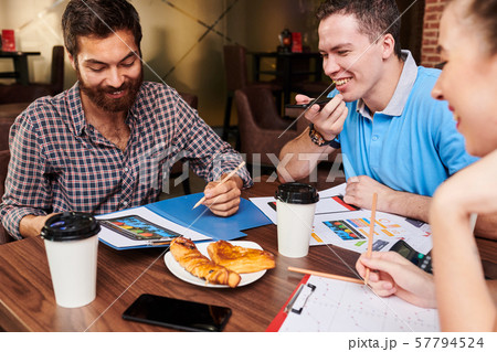 Project managers meeting in cafe 57794524