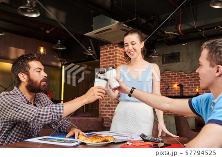 Creative managers toasting with coffee Creative managers toasting with coffee 57794525