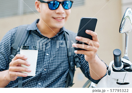 Positive man reading text messages 57795322