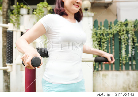 Woman doing triceps exercise 57795443