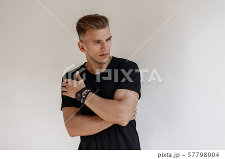 Fashionable handsome young man with hairstyle 57798004