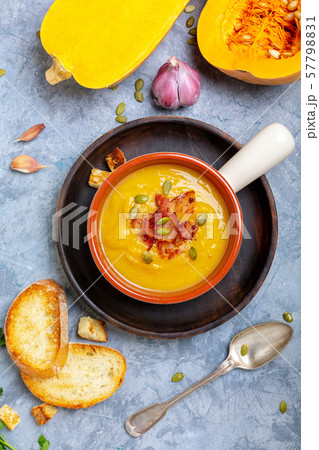 Homemade pumpkin soup with crunchy bacon. Homemade pumpkin soup with crunchy bacon. 57798831
