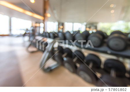Blur gym background fitness center or health club with blurry sports exercise equipment for aerobic workout and bodybuilding Blur gym background fitness center or health club with blurry sports exercise equipment for aerobic workout and bodybuilding 57801802