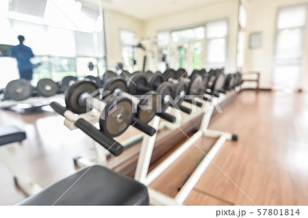 Blur gym background fitness center or health club with blurry sports exercise equipment for aerobic workout and bodybuilding Blur gym background fitness center or health club with blurry sports exercise equipment for aerobic workout and bodybuilding 57801814