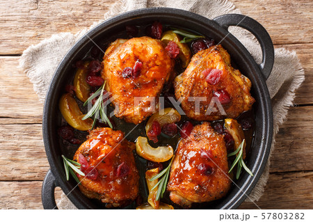 Holiday food hot baked chicken thighs with apples, Holiday food hot baked chicken thighs with apples, 57803282