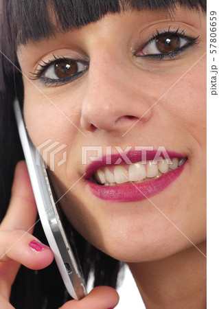 Close up of young attractive woman talking on the Close up of young attractive woman talking on the 57806659