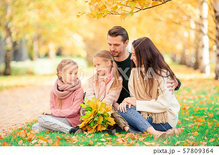 Portrait of happy family of four in autumn day 57809364