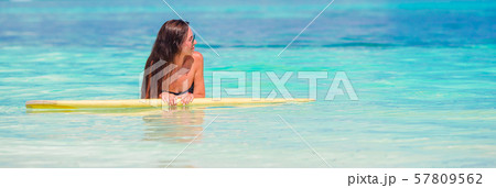 Beautiful fitness surfer woman surfing during summer vacation Beautiful fitness surfer woman surfing during summer vacation 57809562
