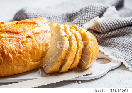 Sliced wheat bread on the white board. 57810061