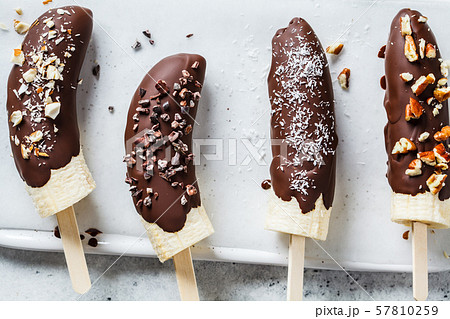 Vegan dessert for kids. Banana in dark chocolate Vegan dessert for kids. Banana in dark chocolate 57810259