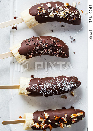 Vegan dessert for kids. Banana in dark chocolate 57810263