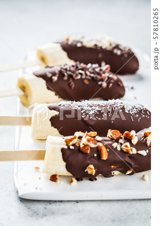 Vegan dessert for kids. Banana in dark chocolate Vegan dessert for kids. Banana in dark chocolate 57810265