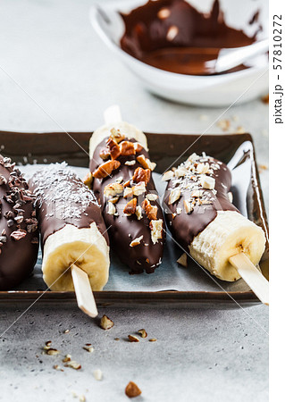 Vegan dessert for kids. Banana in dark chocolate Vegan dessert for kids. Banana in dark chocolate 57810272