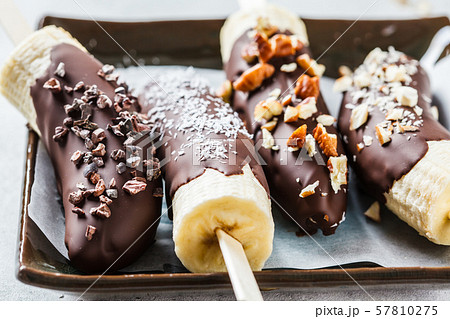 Vegan dessert for kids. Banana in dark chocolate 57810275