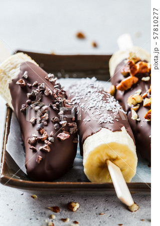 Vegan dessert for kids. Banana in dark chocolate 57810277